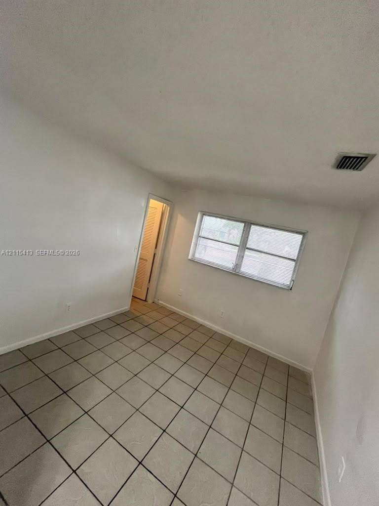 3001 NW 4th Terrace, #173, Pompano Beach, Pompano Beach, FL 33064 Neutral wall finish, ceramic tile flooring, and horizontal sliding window with metal frame
