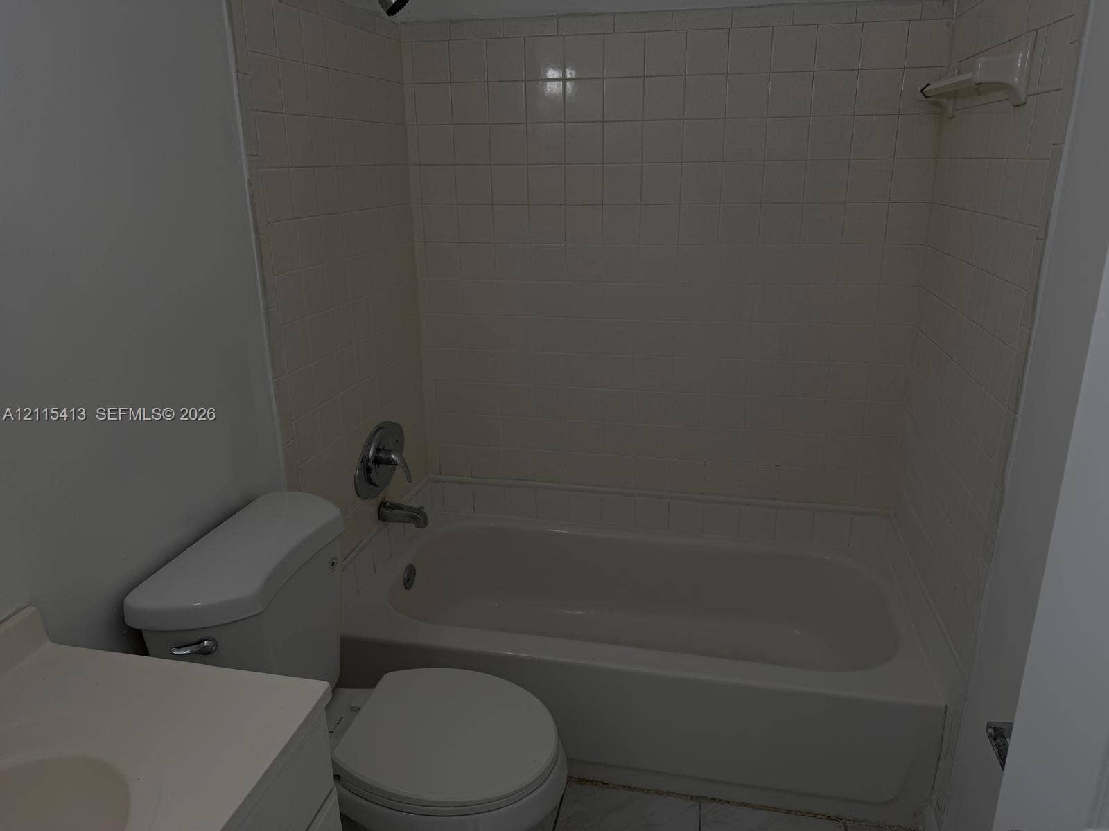 3001 NW 4th Terrace, #173, Pompano Beach, Pompano Beach, FL 33064 Bathroom featuring a tub and shower combination with tile surround, porcelain toilet, and vanity with an integrated basin