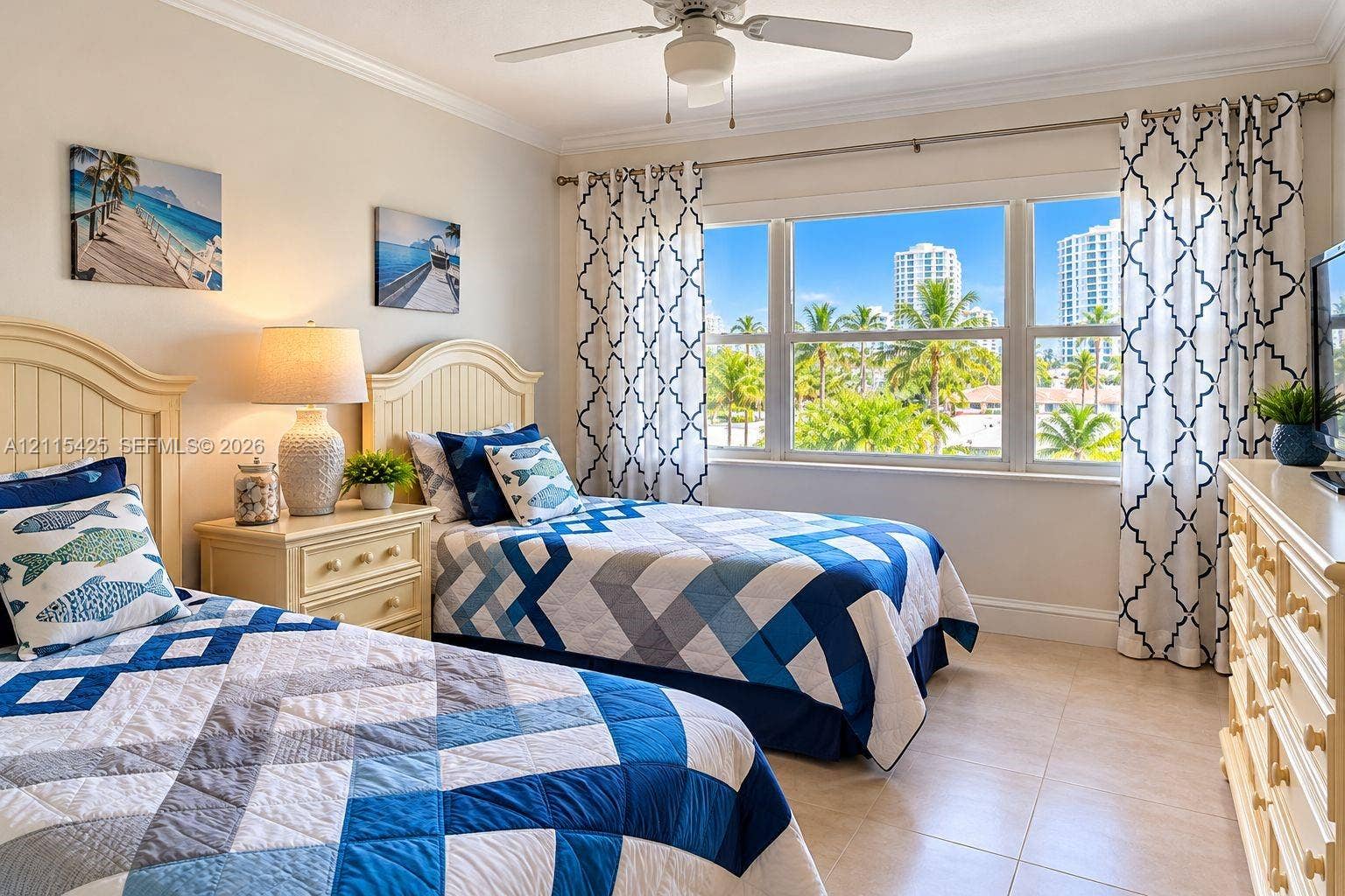 550 Bayshore Drive, #404, Fort Lauderdale, FL 33304 Large multi-pane window with natural light exposure, tile flooring, crown molding, and ceiling fan