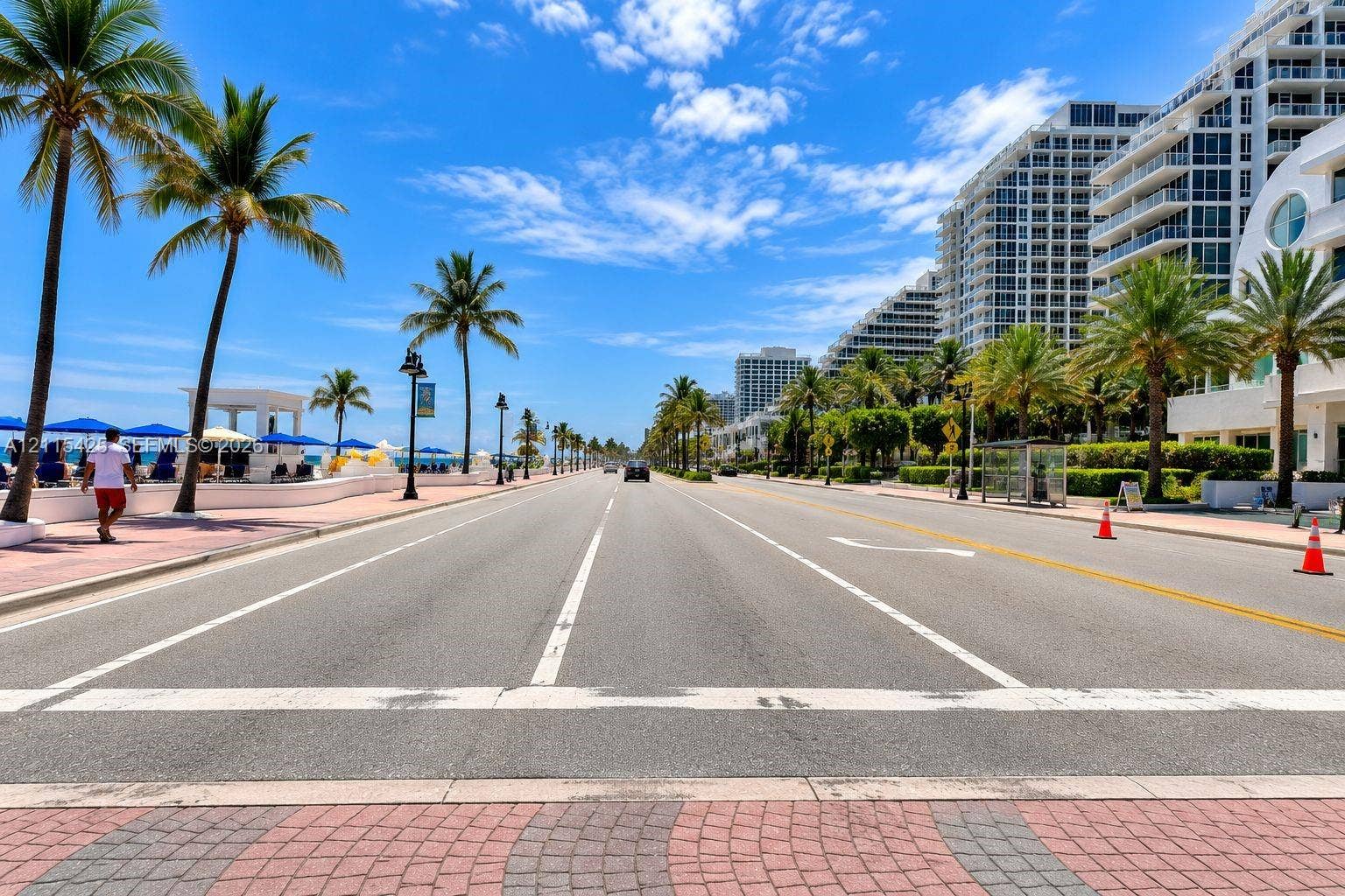 550 Bayshore Drive, #404, Fort Lauderdale, FL 33304 Coastal thoroughfare featuring paved multi-lane roadway, interlocking brick sidewalks, and established palm trees
