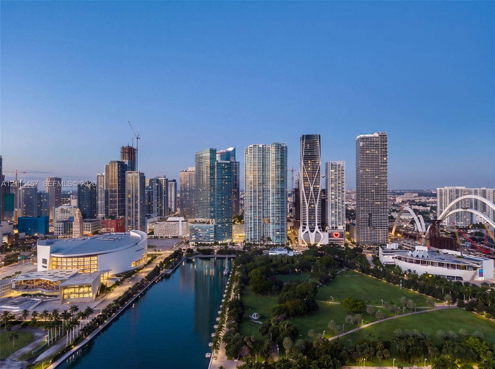 900 Biscayne Boulevard, #2104, Miami, FL 33132 Aerial perspective of urban skyline featuring high-rise buildings, expansive public parkland, waterway, and large-scale architectural landmarks