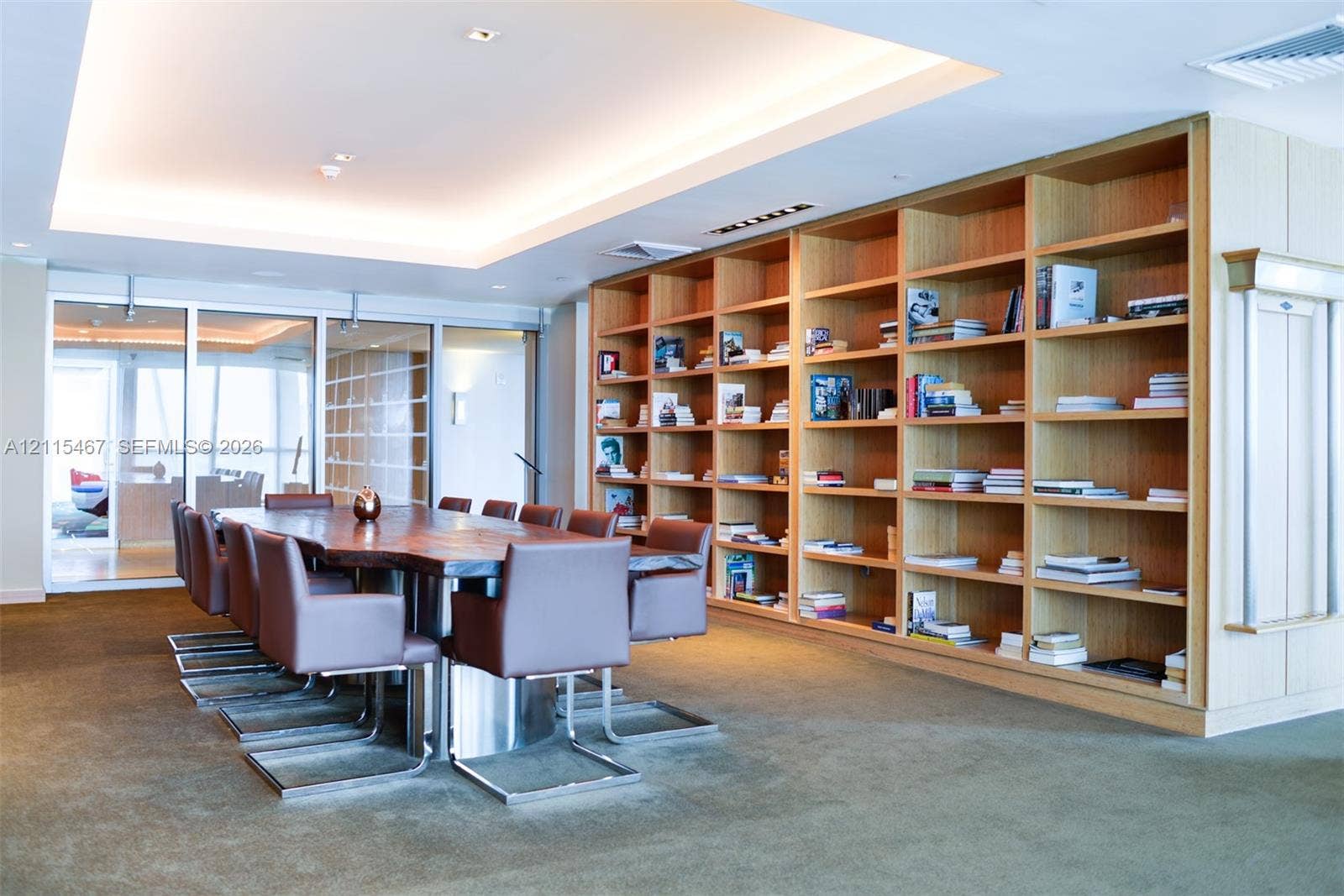 900 Biscayne Boulevard, #2104, Miami, FL 33132 Floor-to-ceiling built-in wood shelving, coffered ceiling with recessed lighting, and expansive glass paneled partitions