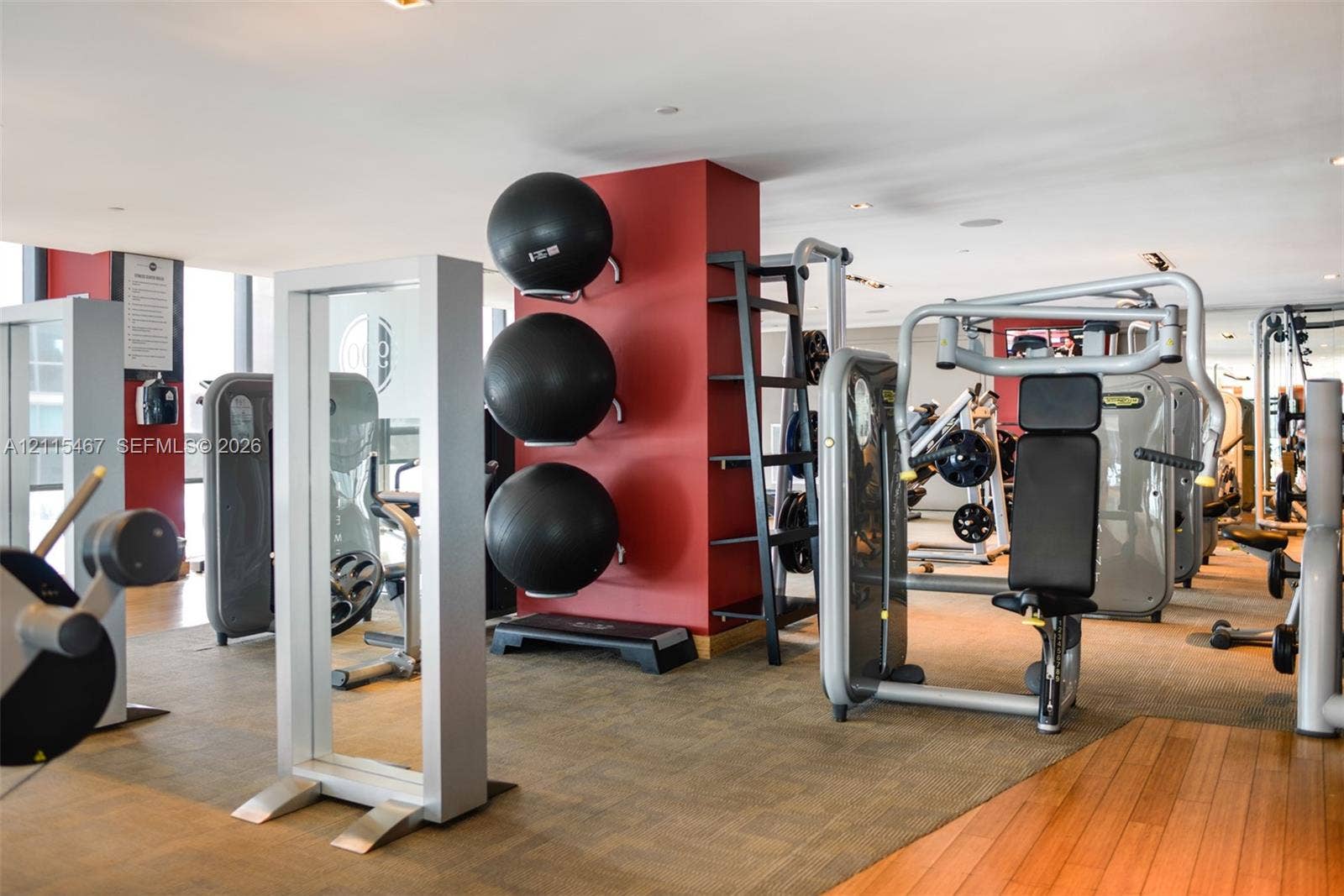 900 Biscayne Boulevard, #2104, Miami, FL 33132 Fitness area featuring wood-finish flooring, recessed lighting, and wall-mounted storage racks