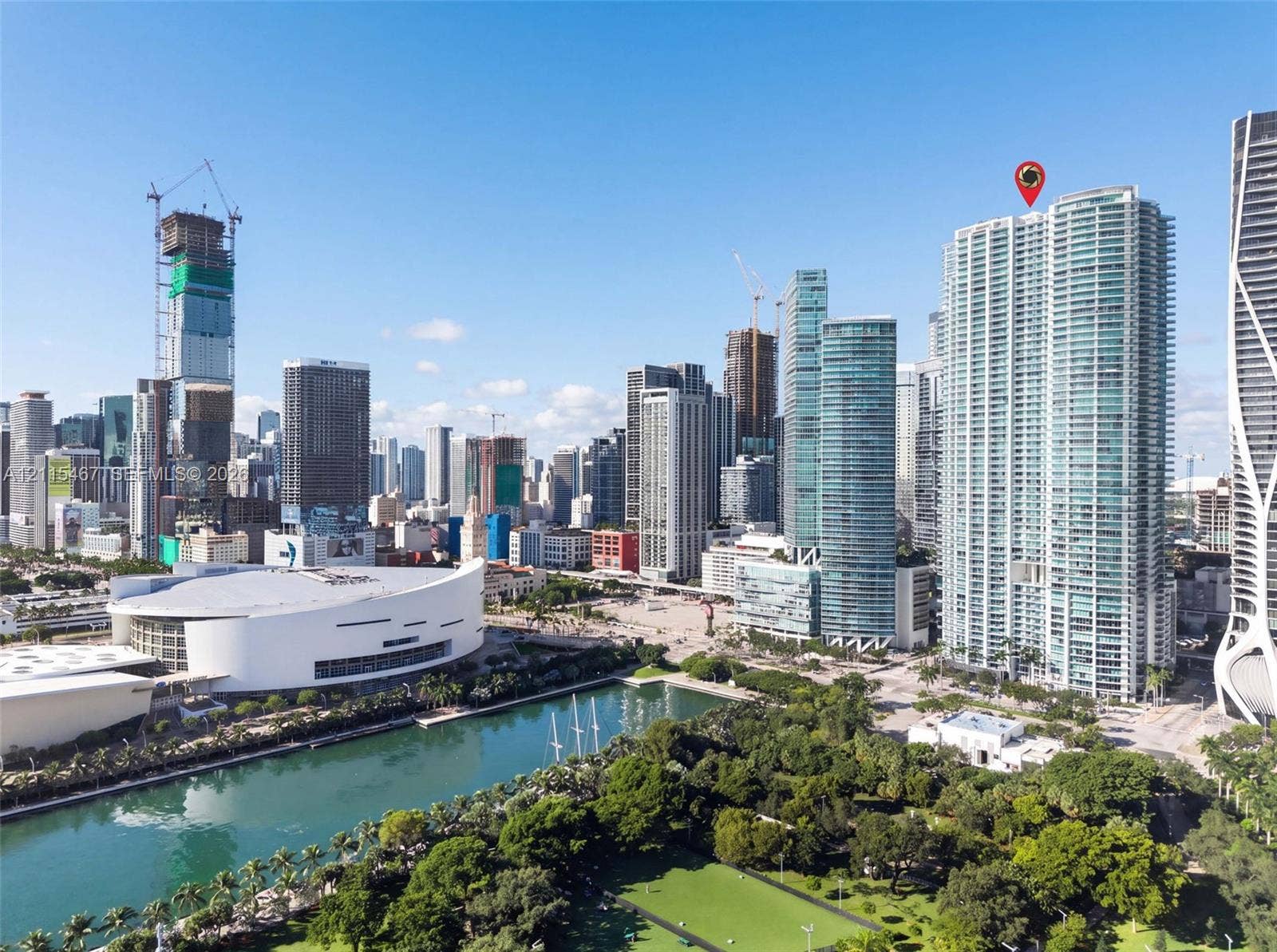 900 Biscayne Boulevard, #2104, Miami, FL 33132 High-rise residential tower located within a metropolitan urban district featuring expansive glass-facade architecture, proximity to waterfront green space, and regional stadium infrastructure