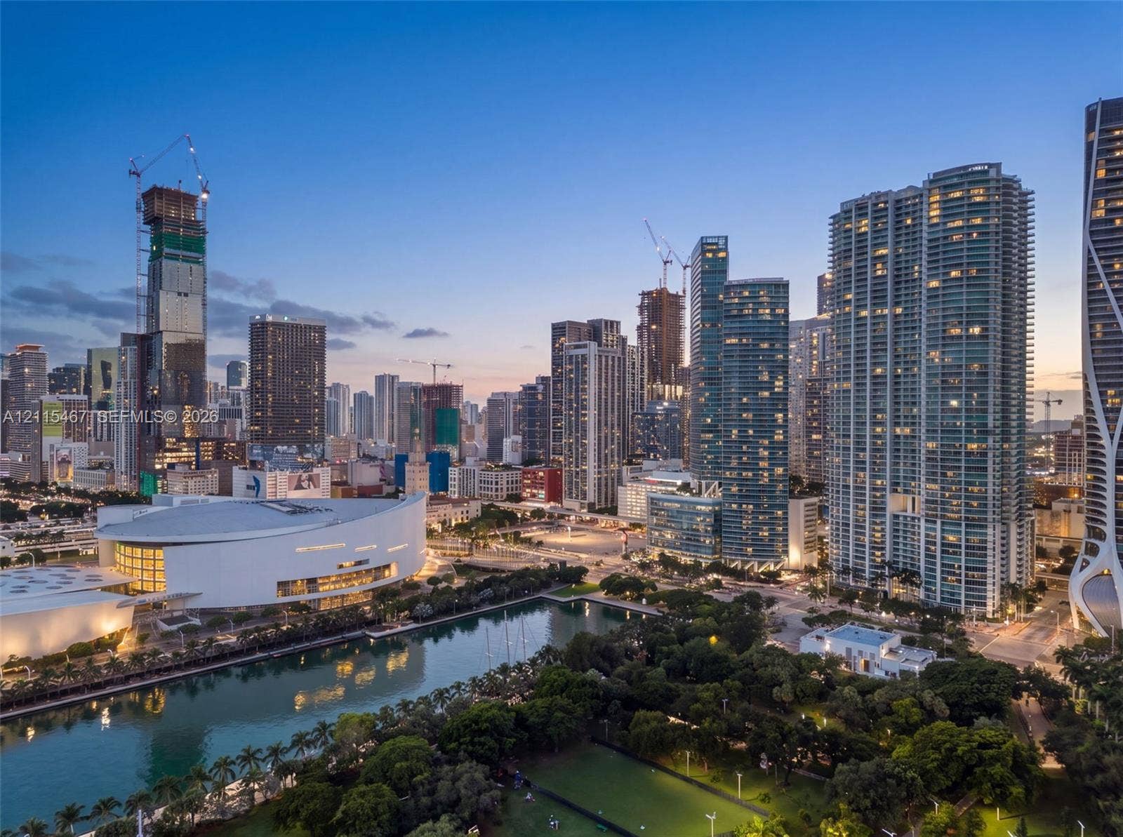 900 Biscayne Boulevard, #2104, Miami, FL 33132 Panoramic cityscape featuring high-rise architecture, a multi-purpose arena, waterfront access, and mature canopy greenery
