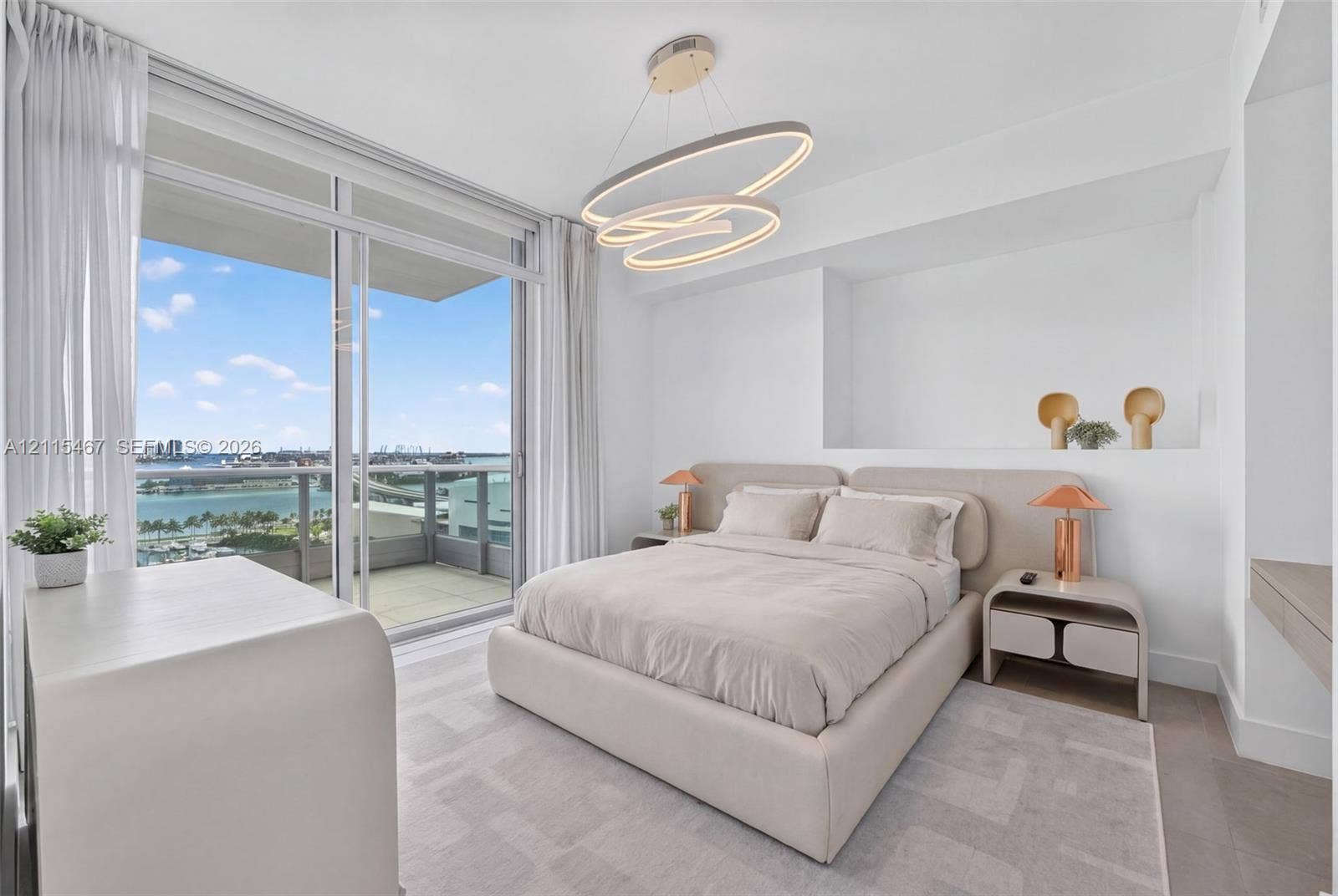 900 Biscayne Boulevard, #2104, Miami, FL 33132 Floor-to-ceiling sliding glass door, private balcony, contemporary oval-shaped pendant lighting, and built-in wall niche