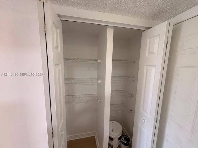 9301 SW 92nd Avenue, #A418, Miami, Miami, FL 33176 Storage closet featuring double-panel doors and integrated white wire shelving
