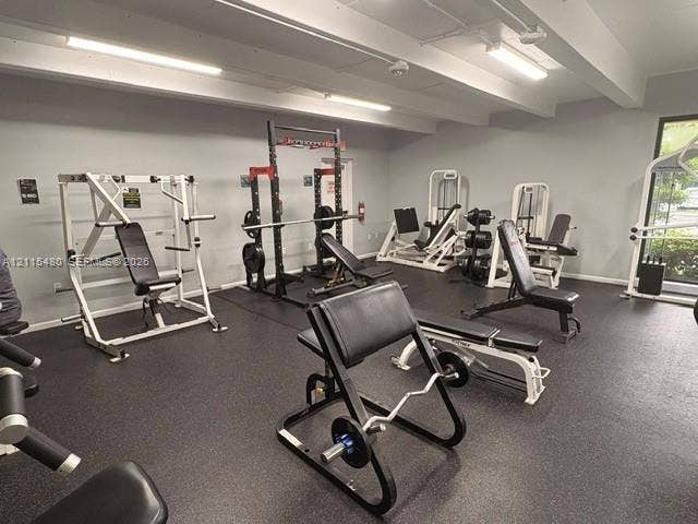 9301 SW 92nd Avenue, #A418, Miami, Miami, FL 33176 Fitness area featuring rubberized flooring, exposed ceiling beams, and industrial-grade overhead lighting
