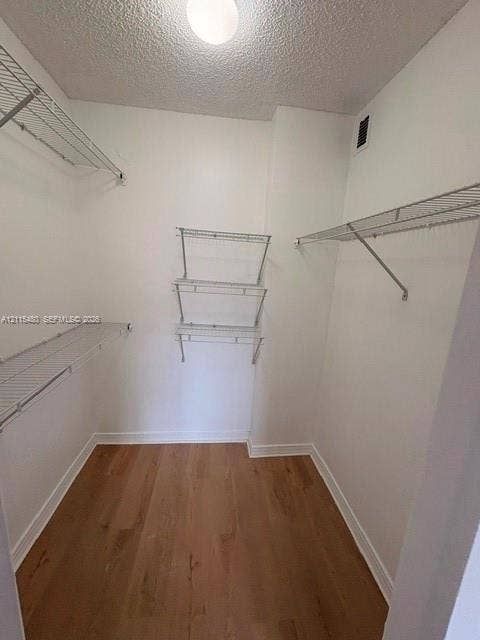 9301 SW 92nd Avenue, #A418, Miami, Miami, FL 33176 Walk-in storage space featuring wood-finish flooring and tiered metal shelving