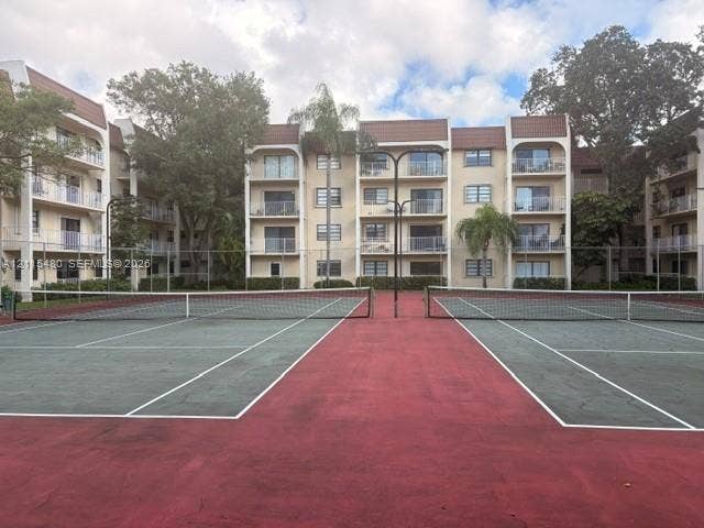 9301 SW 92nd Avenue, #A418, Miami, Miami, FL 33176 Dual tennis courts with red and green surfacing, enclosed by perimeter fencing