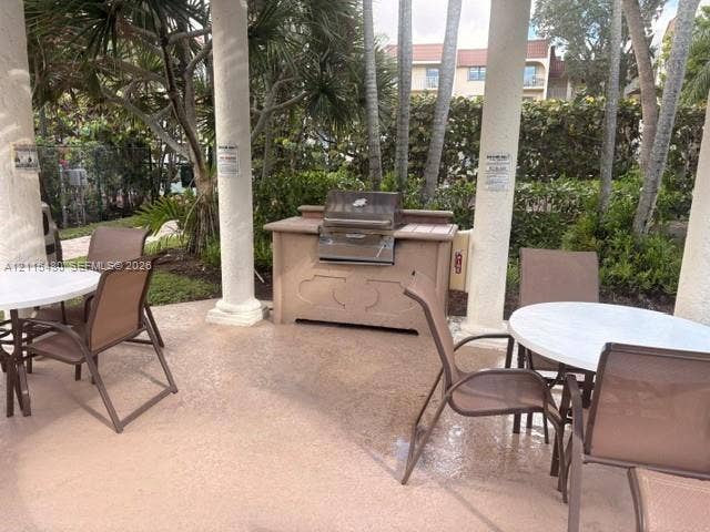 9301 SW 92nd Avenue, #A418, Miami, Miami, FL 33176 Covered outdoor pavilion featuring structural columns and a built-in stainless steel grill