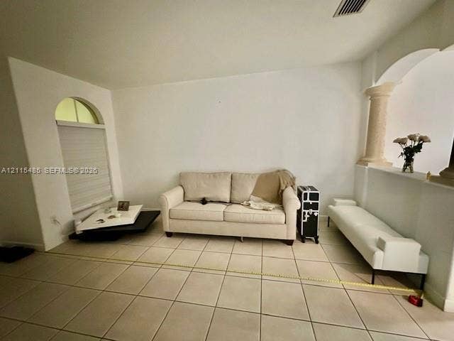 14973 SW 9th Terrace, Miami, Miami, FL 33194 Ceramic tile flooring, arched window with semi-circular transom, and decorative column featuring a stone-finish pedestal