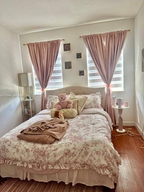 14973 SW 9th Terrace, Miami, Miami, FL 33194 Wood-finish flooring, dual windows with banded roller shades, and gold-finish curtain hardware