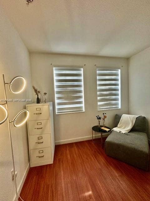 14973 SW 9th Terrace, Miami, Miami, FL 33194 Room featuring wood-finish flooring, dual windows with banded roller shades, and neutral wall tones