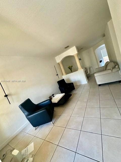 14973 SW 9th Terrace, Miami, Miami, FL 33194 Large-format tile flooring, arched architectural divider, and dual structural columns