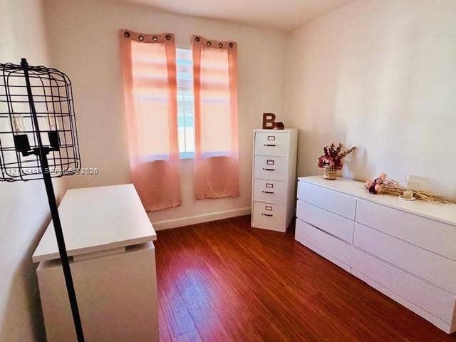 14973 SW 9th Terrace, Miami, Miami, FL 33194 Room featuring wood-finish flooring, a single window, and neutral walls