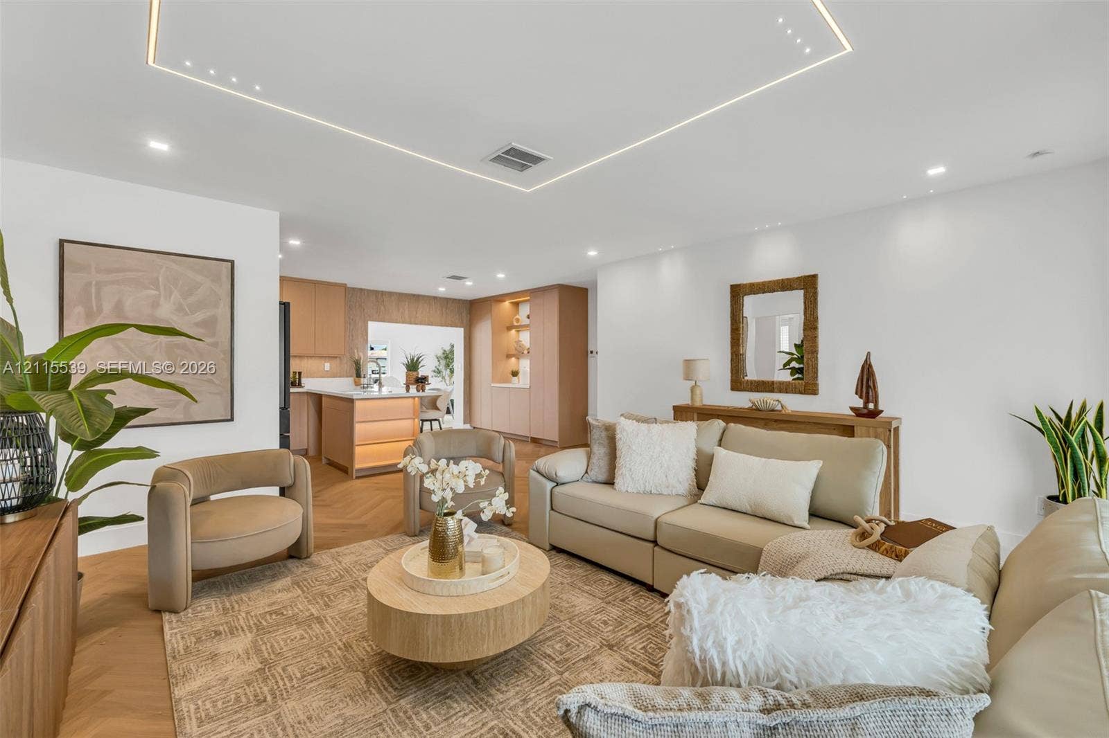 381 SE 6th Terrace, Pompano Beach, FL 33060 Herringbone-patterned wood-finish flooring, geometric recessed ceiling lighting, and custom light-toned cabinetry with integrated shelving