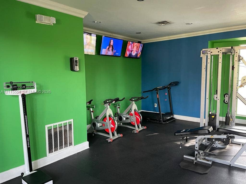 10781 Cleary Boulevard, #210, Plantation, Plantation, FL 33324 Dedicated fitness space featuring recessed lighting, crown molding, and durable rubber flooring