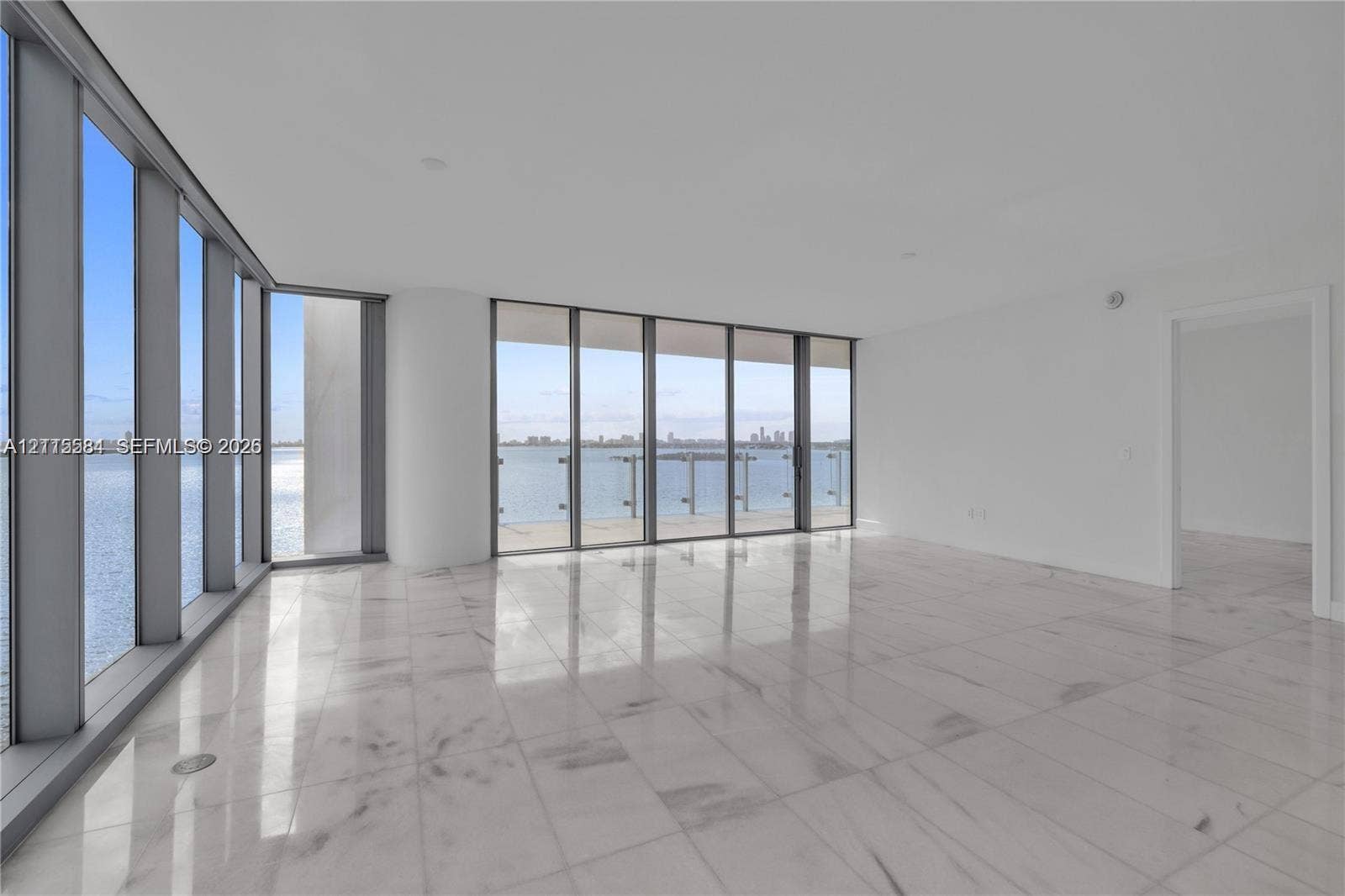 700 NE 26th Terrace, #901, Miami, Miami, FL 33137 Floor-to-ceiling windows, polished stone flooring, and metal-framed exterior railing