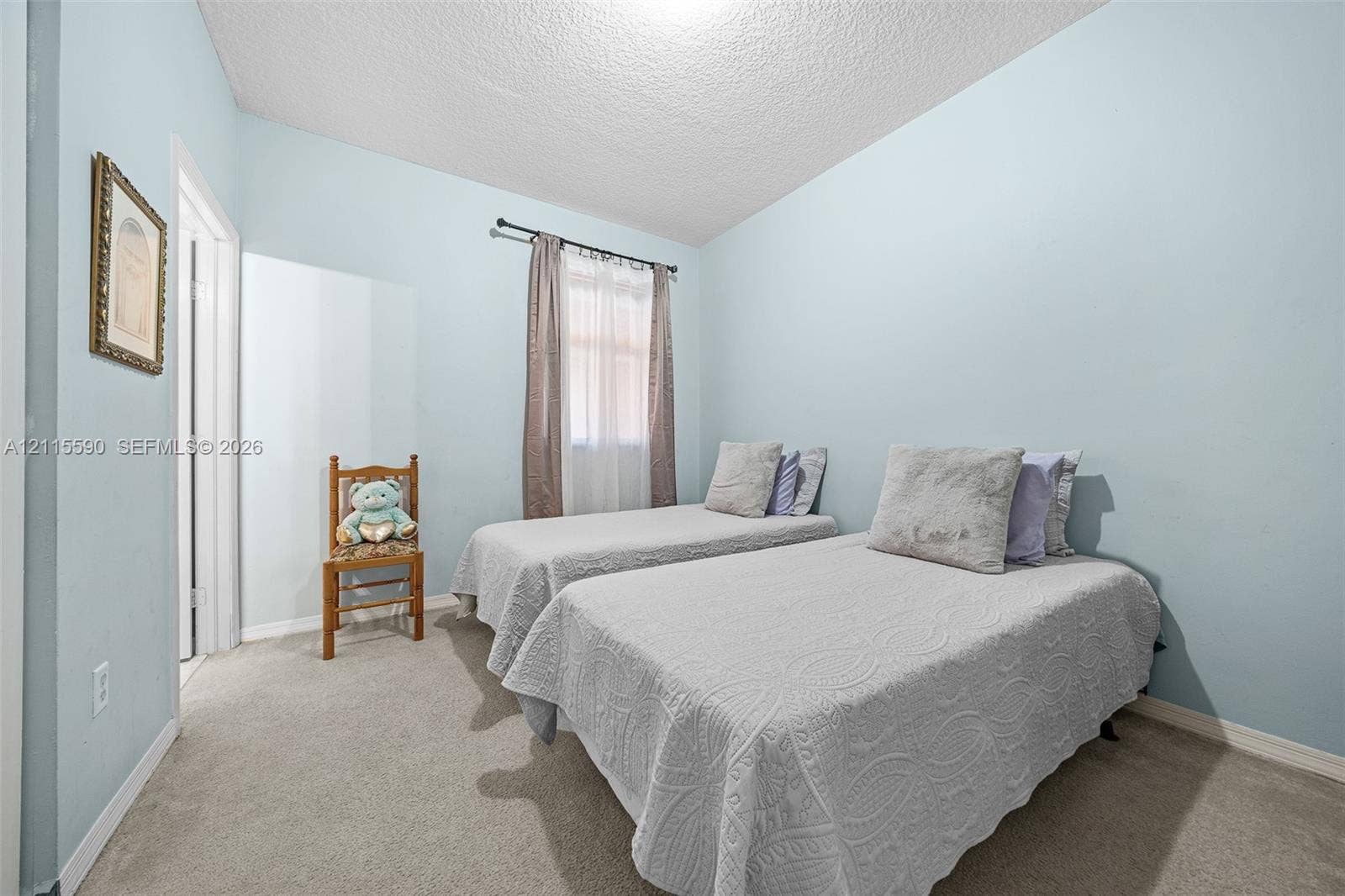 4948 Tradewinds Terrace, #504, Dania Beach, FL 33312 Room featuring neutral carpeting, light-toned wall paint, and a window with a mounted rod