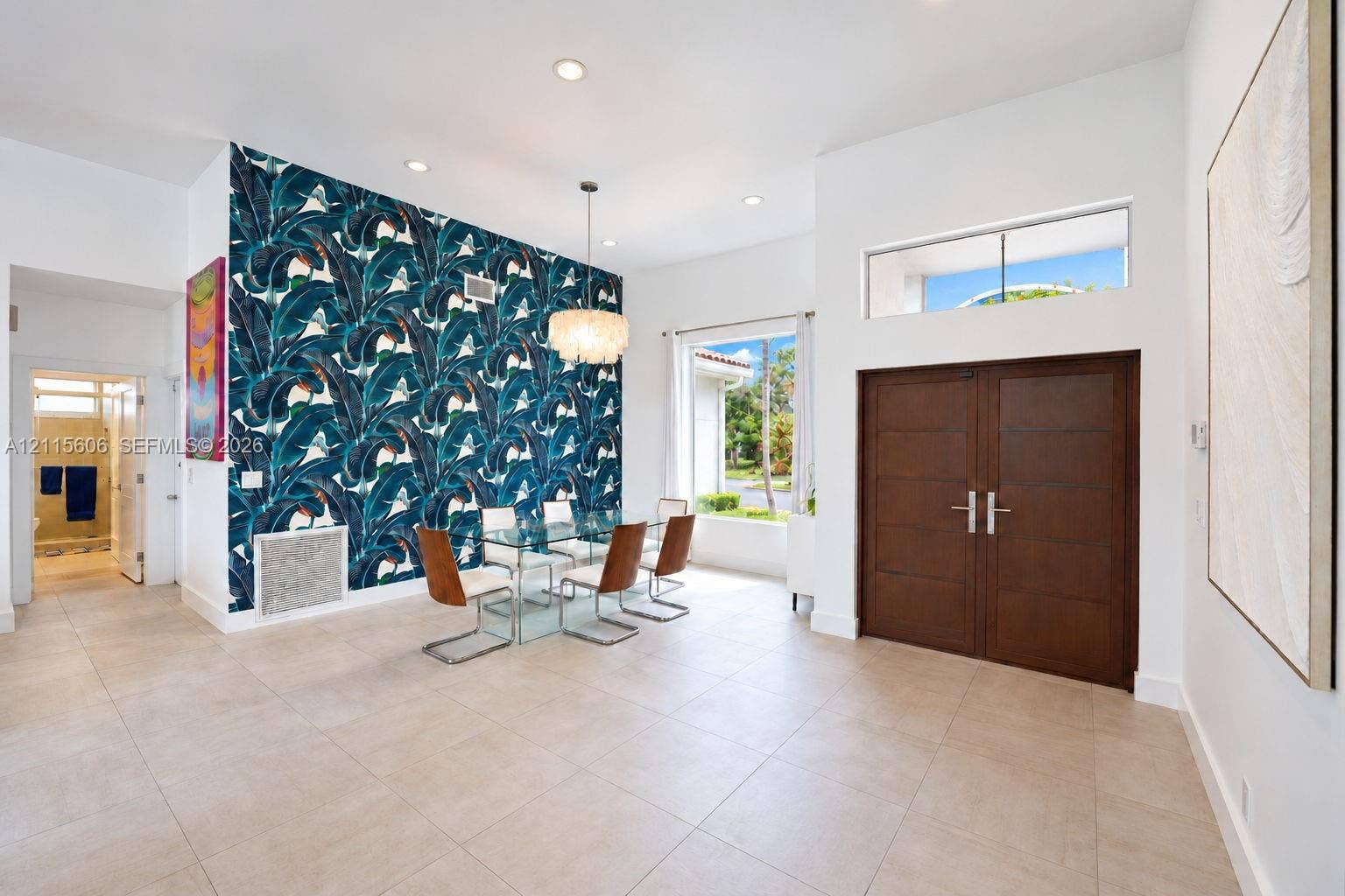 2652 Palmer Place, #2652, Weston, Weston, FL 33332 Formal entry featuring double wood doors, transom window, large-format tile flooring, recessed lighting, and a decorative accent wall
