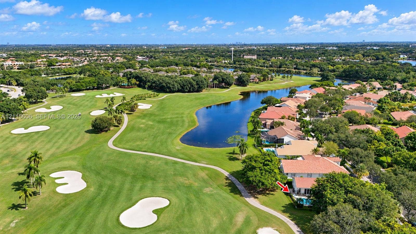 2652 Palmer Place, #2652, Weston, Weston, FL 33332 Aerial perspective featuring a property situated on a golf course with a dedicated swimming pool, tile roofing, and surrounding mature landscaping