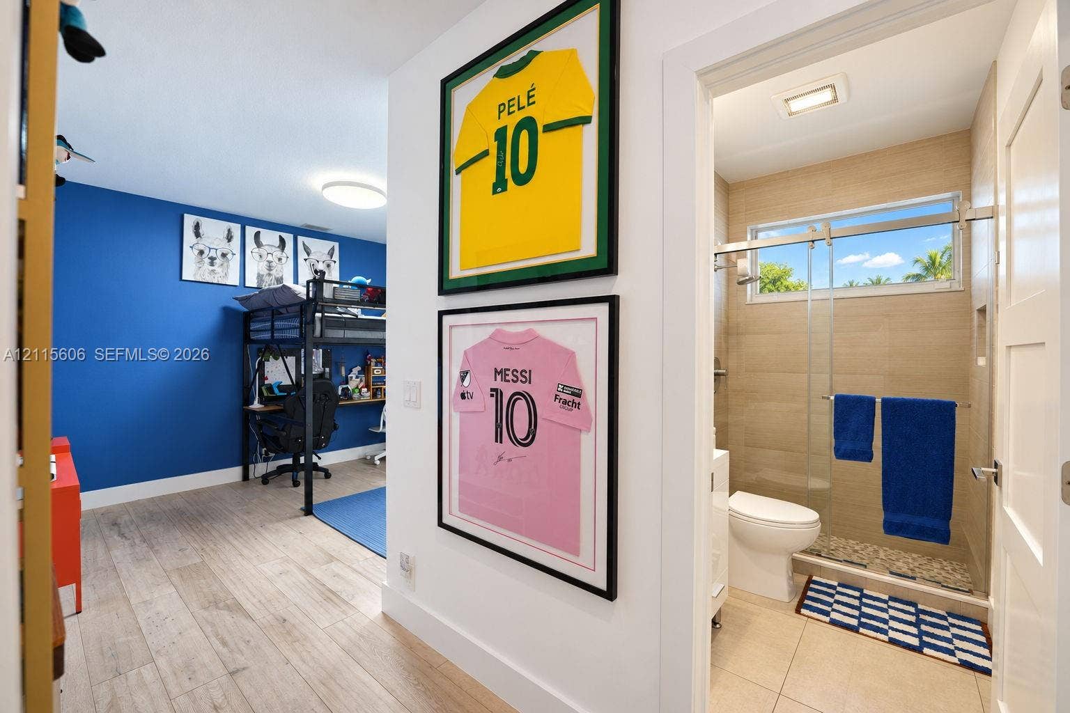 2652 Palmer Place, #2652, Weston, Weston, FL 33332 Wood-finish flooring throughout, bathroom featuring beige wall tile, a glass-enclosed shower with a stone-finish floor, and a rectangular horizontal window