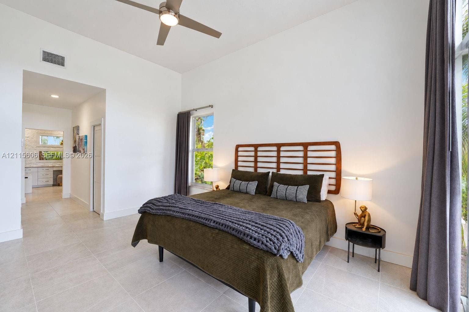 2652 Palmer Place, #2652, Weston, Weston, FL 33332 High ceilings, light-tone tile flooring, neutral wall finish, and a ceiling fan with integrated lighting