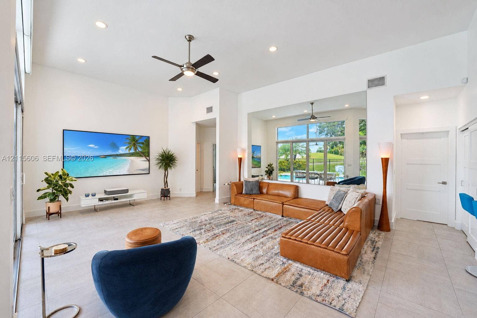 2652 Palmer Place, #2652, Weston, Weston, FL 33332 Living area featuring high ceilings, large-format tile flooring, recessed lighting, ceiling fan, and expansive sliding glass doors