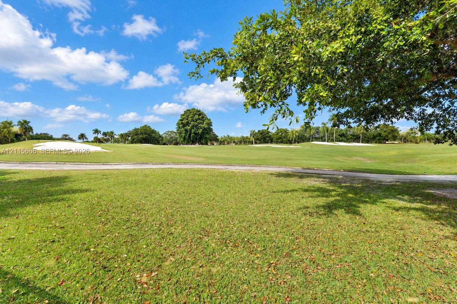 2652 Palmer Place, #2652, Weston, Weston, FL 33332 Expansive green space featuring golf course fairways, sand bunkers, paved cart paths, and mature landscaping