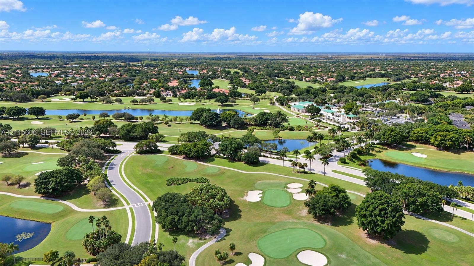 2652 Palmer Place, #2652, Weston, Weston, FL 33332 Aerial perspective featuring a golf course, multiple water features, mature trees, and paved thoroughfares