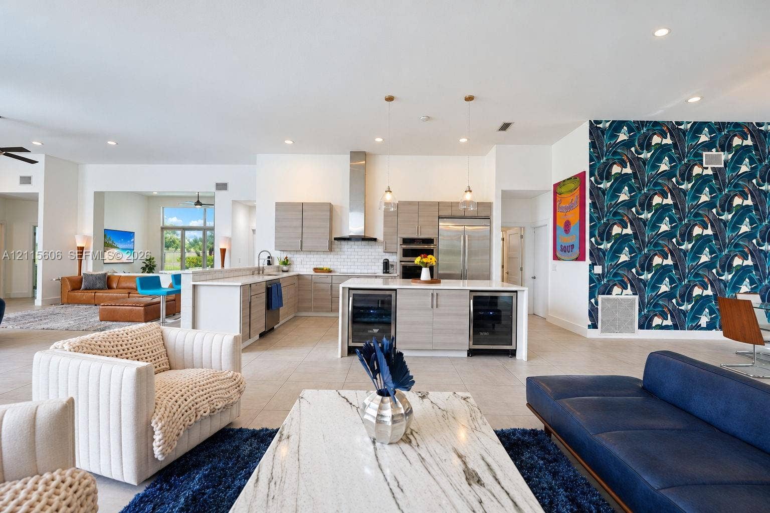 2652 Palmer Place, #2652, Weston, Weston, FL 33332 Kitchen featuring custom horizontal-grain cabinetry, stainless steel appliances, a subway tile backsplash, and a central island with dual under-counter beverage refrigerators