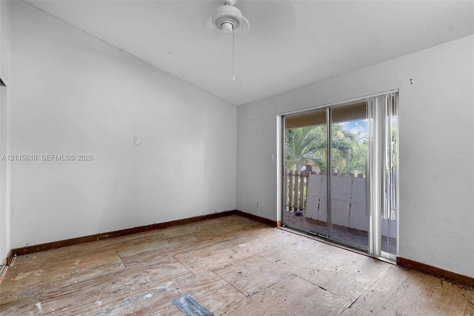 3711 Riverside Drive, Coral Springs, FL 33065 Vaulted ceilings, ceiling fan, and sliding glass door with exterior access