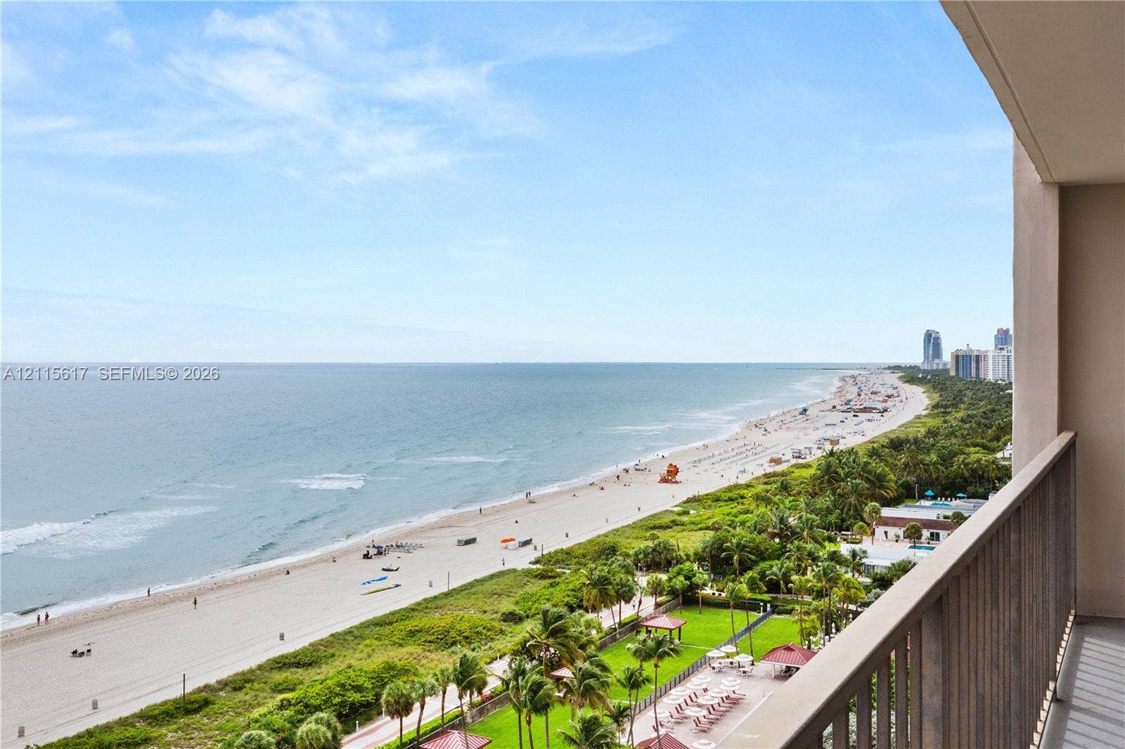 Private balcony featuring metal railings and unobstructed oceanfront scenery