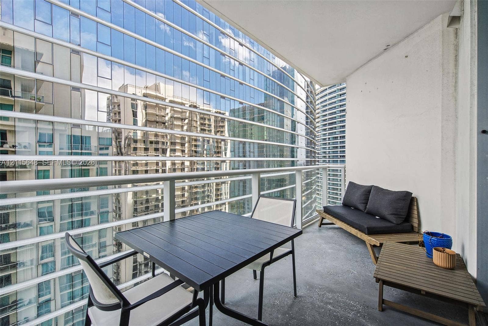 300 S Biscayne Boulevard, #T-3604, Miami, FL 33131 Covered balcony featuring concrete flooring and horizontal metal railings