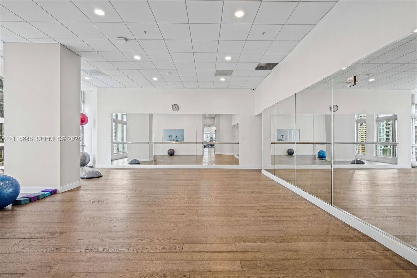300 S Biscayne Boulevard, #T-3604, Miami, FL 33131 Studio space featuring wood-finish flooring, full-length wall mirrors, a metal ballet barre, recessed ceiling lighting, and a drop ceiling