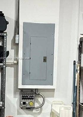 19409 NW 24th Place, Pembroke Pines, FL 33029 Wall-mounted electrical service panel with an integrated generator transfer switch