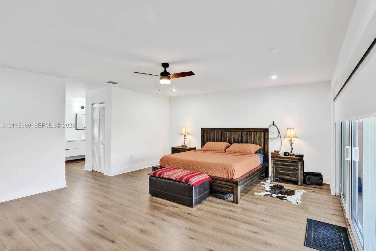 8946 SW 150th Ct Circle E, Miami, Miami, FL 33196 Neutral interior featuring wood-finish flooring, a ceiling fan with integrated lighting, recessed ceiling lights, and sliding glass doors