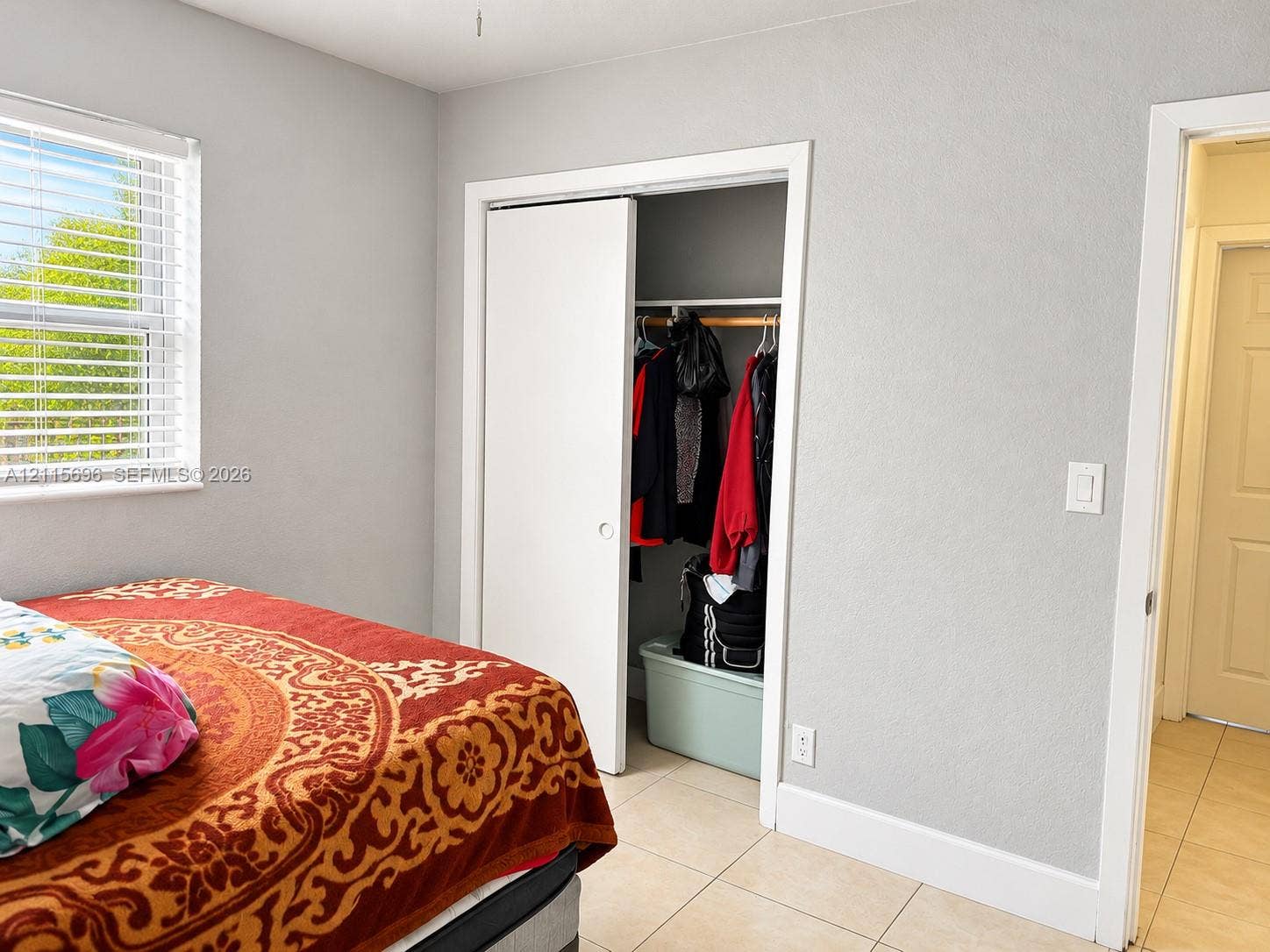 1101 NW 55th Avenue, #B, Lauderhill, Lauderhill, FL 33313 Neutral-toned walls, double-pane sliding window, closet with sliding door, and ceramic tile flooring
