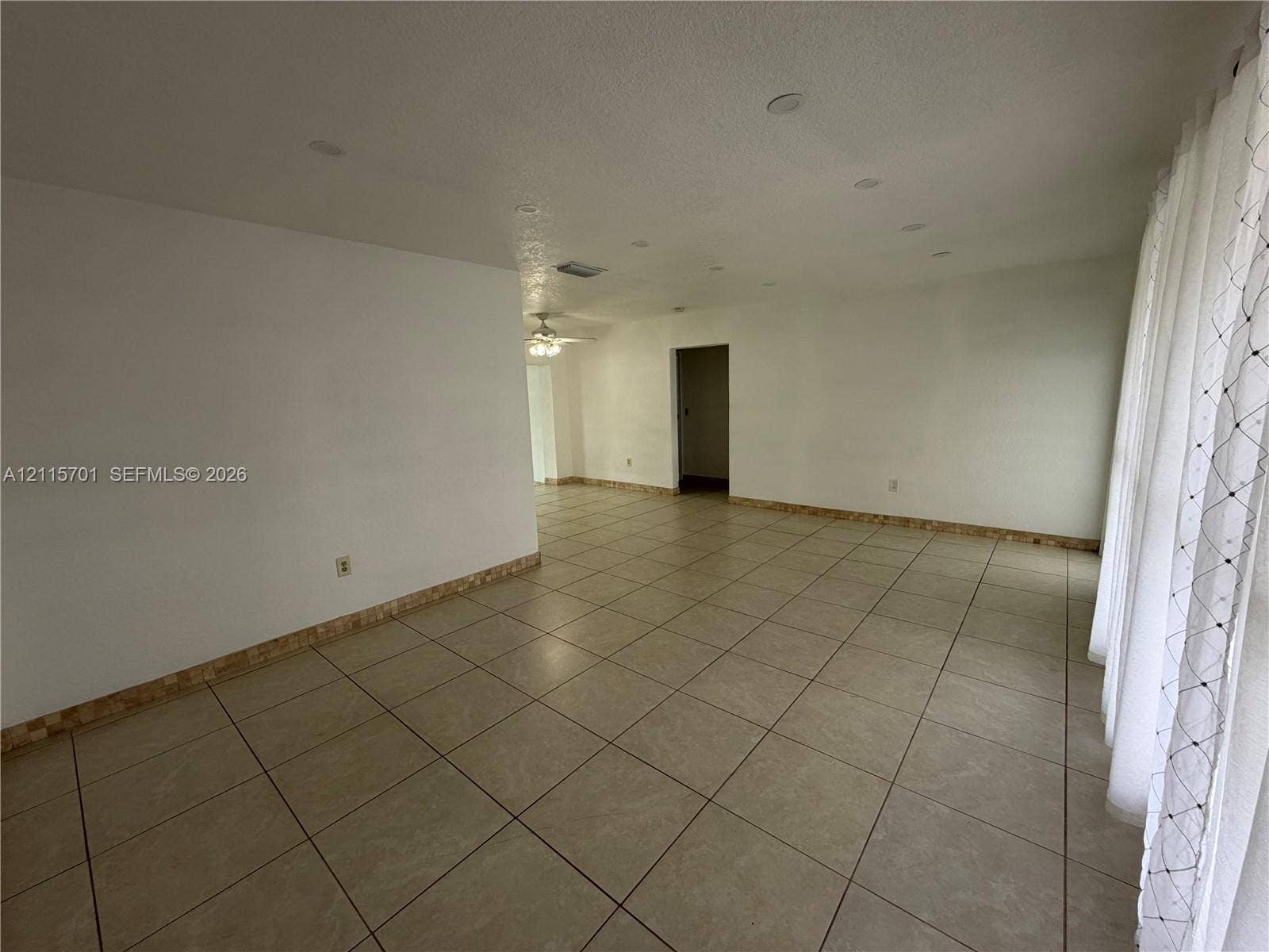 8641 NW 25th Court, #864, Sunrise, Sunrise, FL 33322 Neutral-toned ceramic tile flooring, recessed ceiling lighting, and decorative mosaic tile trim