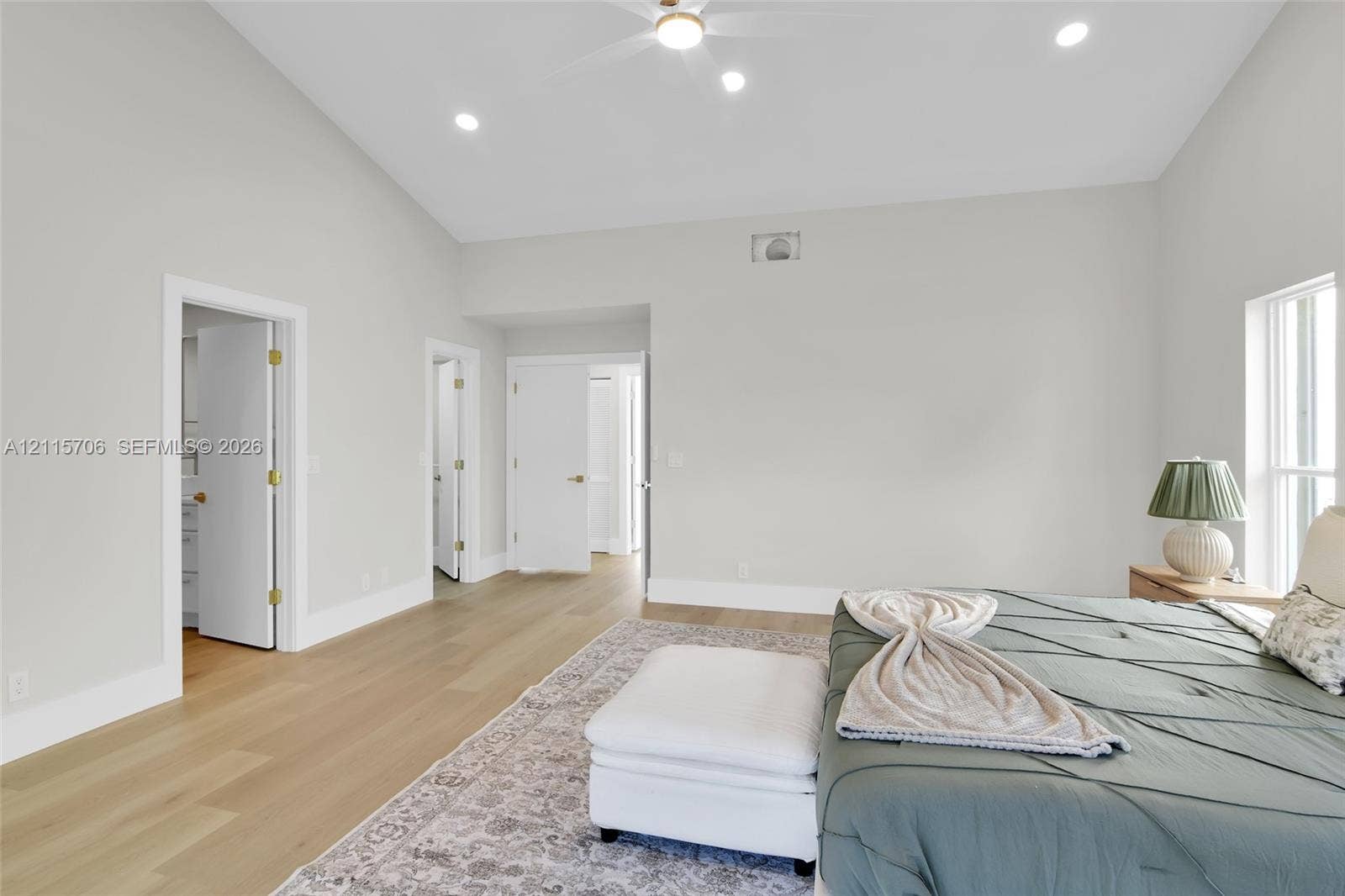5184 Deerhurst Crescent Circle, Boca Raton, FL 33486 Vaulted ceilings, wood-finish flooring, recessed lighting, and a ceiling fan
