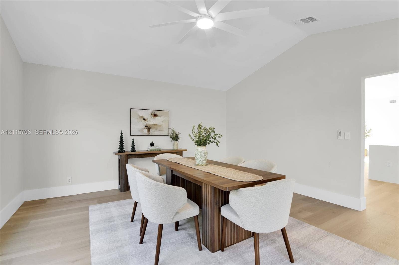 5184 Deerhurst Crescent Circle, Boca Raton, FL 33486 Vaulted ceilings, wood-finish flooring, and a modern ceiling fan with integrated lighting