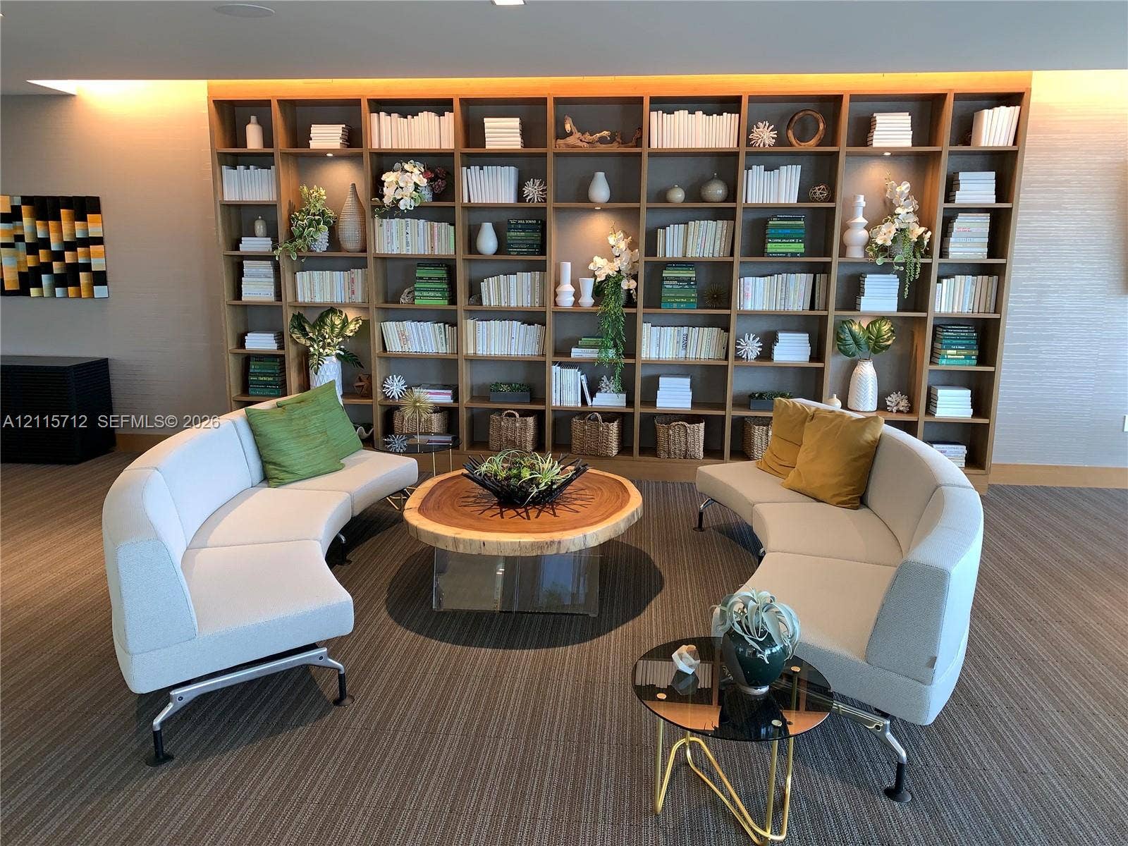 16385 Biscayne Boulevard, #1906, North Miami Beach, North Miami Beach, FL 33160 Full-wall floor-to-ceiling wooden built-in shelving with integrated recessed lighting and textured wall coverings