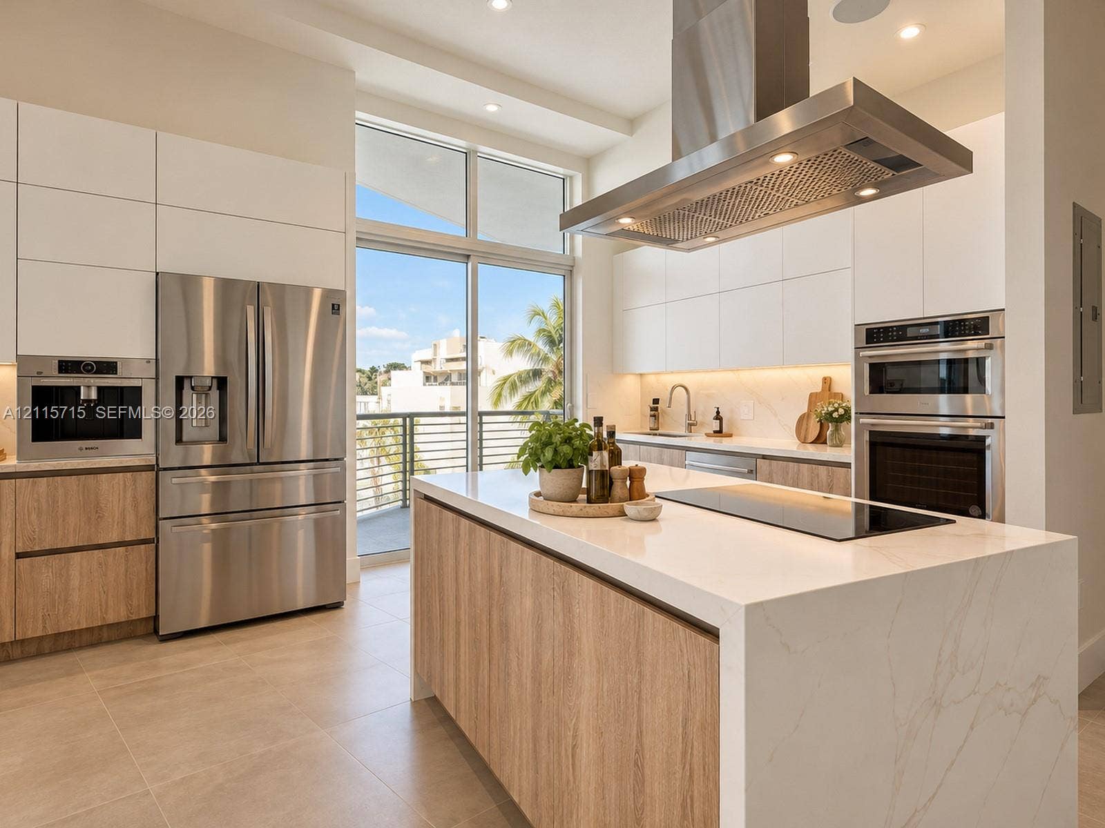 2001 Meridian Avenue, #514, Miami Beach, Miami Beach, FL 33139 Kitchen featuring a waterfall-edge stone island, built-in stainless steel appliances, flat-panel cabinetry, a stainless steel chimney range hood, and floor-to-ceiling glass sliding doors