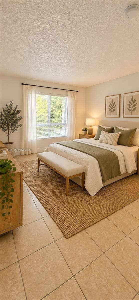 11110 SW 196th Street, #212, Cutler Bay, Cutler Bay, FL 33157 Neutral-toned tile flooring, large-format window with horizontal blinds, and smooth-finish ceiling