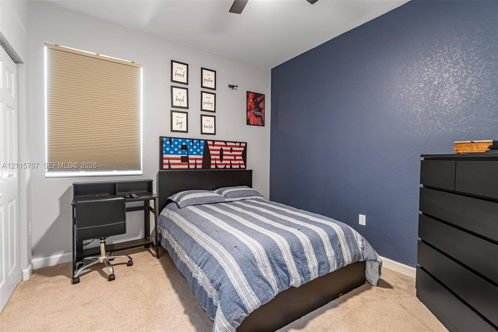 17046 SW 94th Lane, Miami, Miami, FL 33196 Neutral-toned carpeting, accent wall painted in navy blue, pleated window shade, and ceiling fan