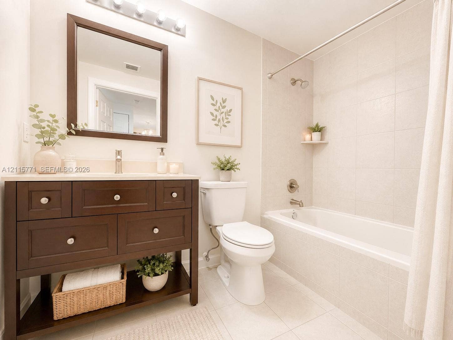 140 S Dixie Highway, #433, Hollywood, Hollywood, FL 33020 Dark wood-finish vanity with a rectangular sink, brushed nickel hardware, square wall-mounted mirror, and tiled shower surround with a built-in shelf