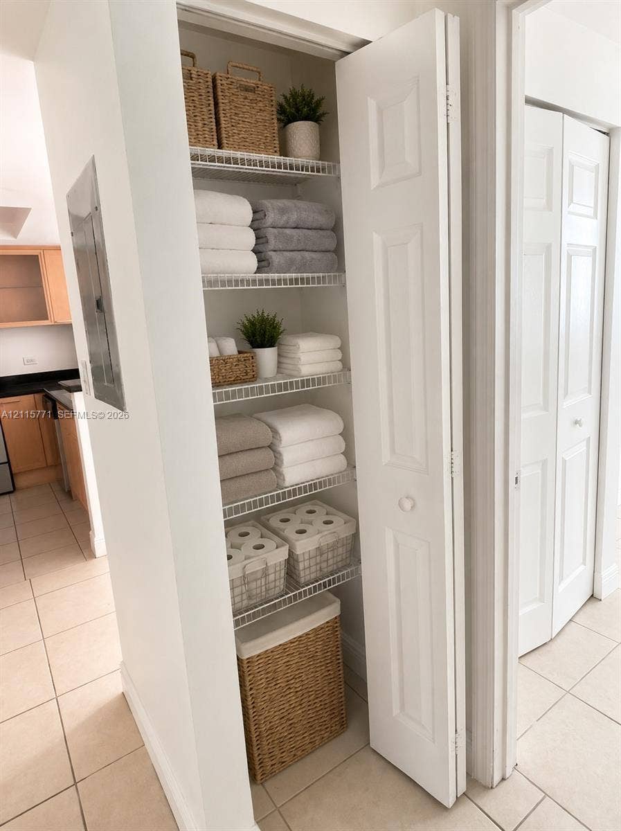 140 S Dixie Highway, #433, Hollywood, Hollywood, FL 33020 Built-in storage closet featuring white bi-fold doors and ventilated wire shelving