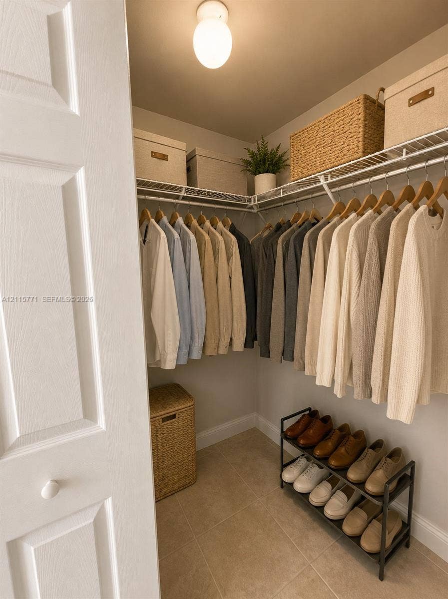 140 S Dixie Highway, #433, Hollywood, Hollywood, FL 33020 Walk-in closet featuring ceramic tile flooring, tiered wire shelving, and a spherical flush-mount ceiling light