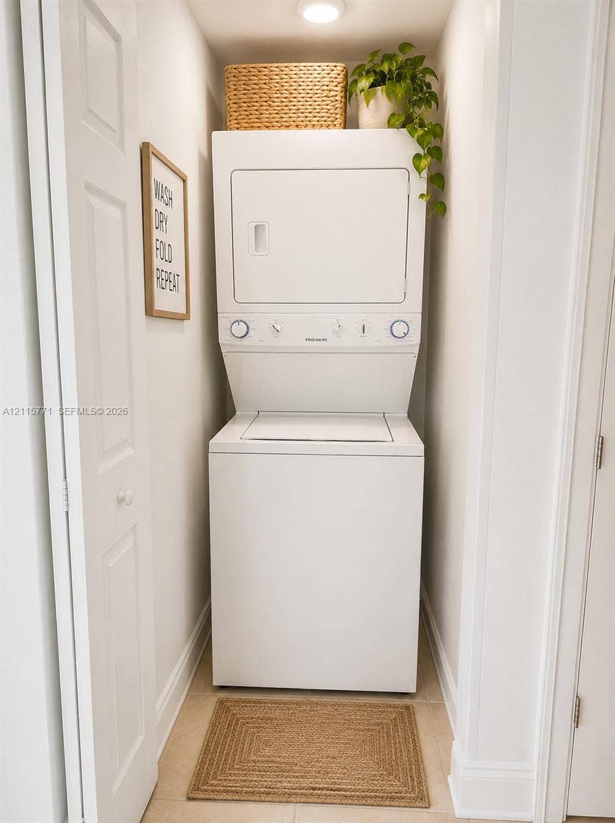140 S Dixie Highway, #433, Hollywood, Hollywood, FL 33020 Stacked laundry unit with white finish, recessed ceiling lighting, and tile flooring